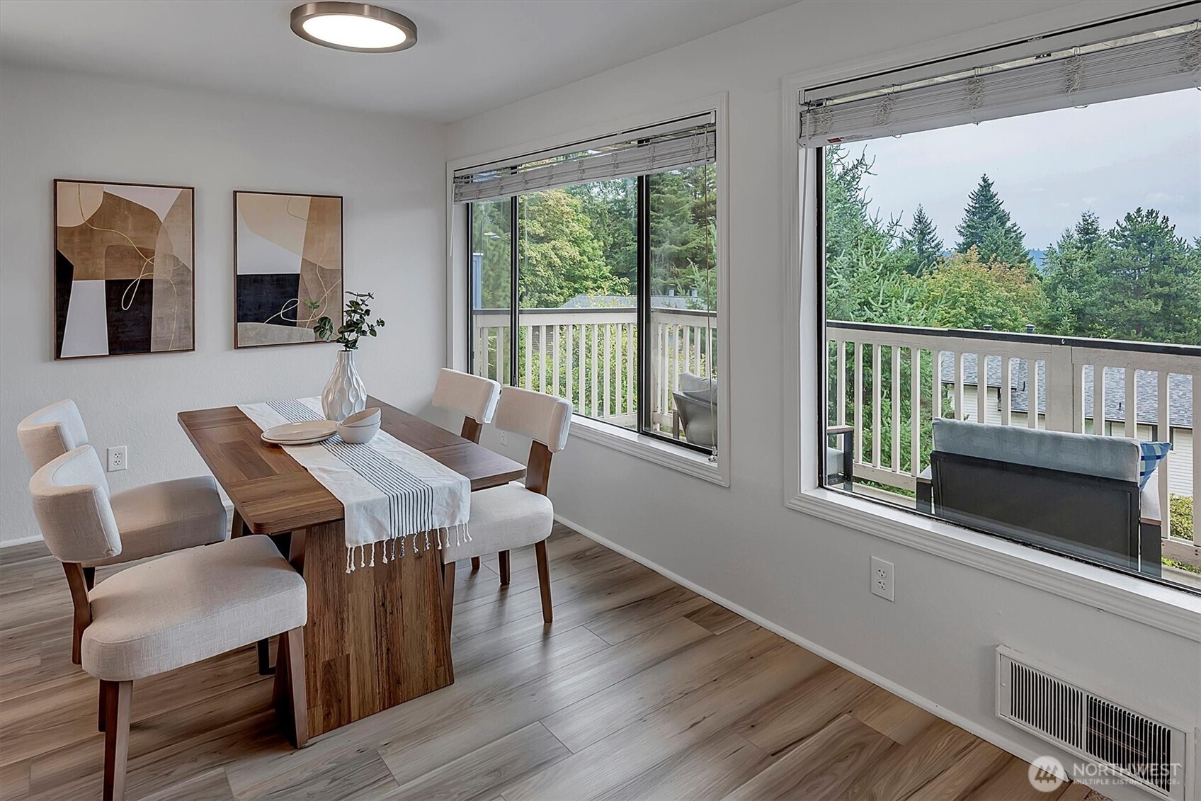 3410 161st Court Southeast, Unit 31 Bellevue, WA 98008 - Photo 13 of 25 a view of a dining room with furniture window and wooden floor