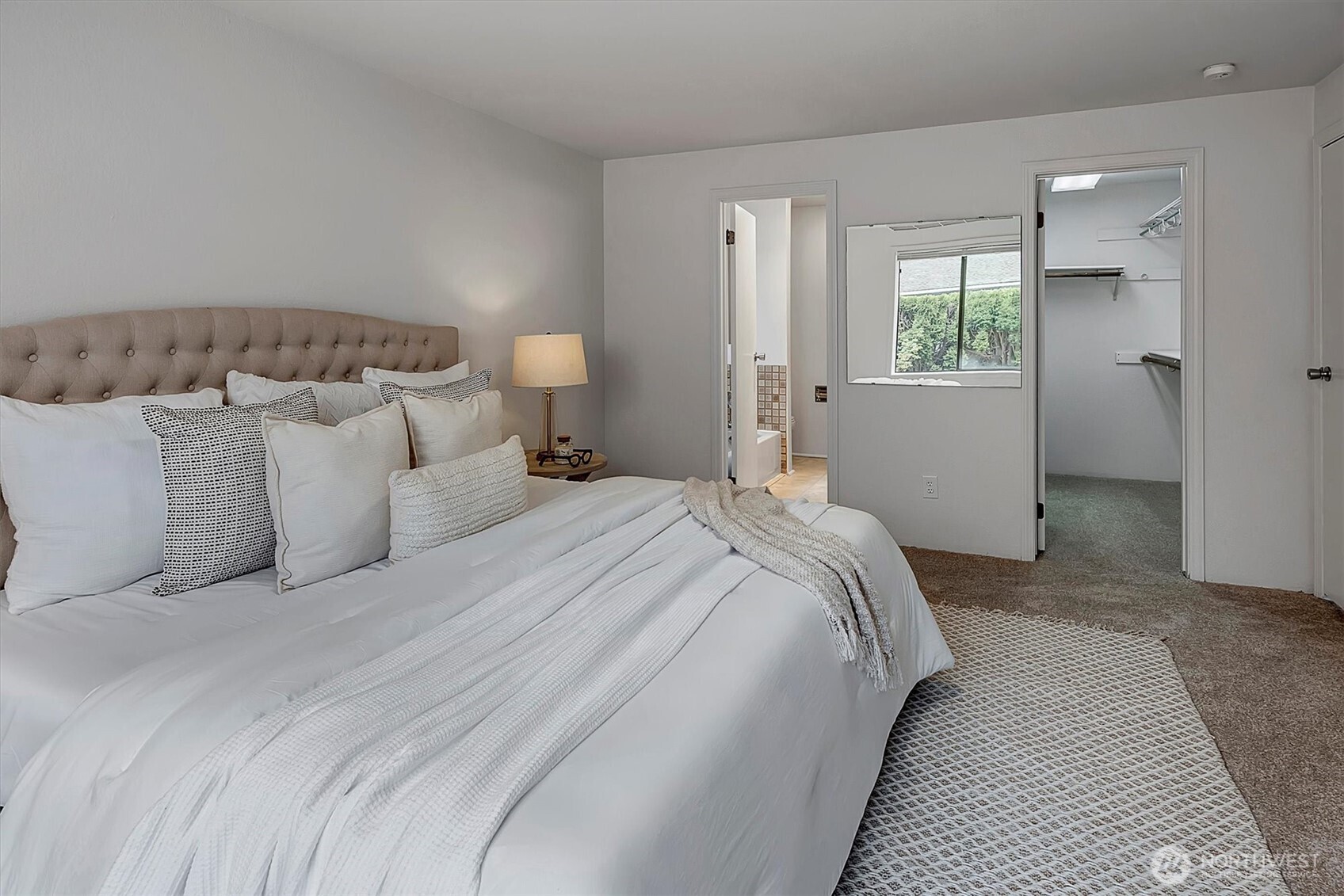 3410 161st Court Southeast, Unit 31 Bellevue, WA 98008 - Photo 15 of 25 a bedroom with a bed and a window