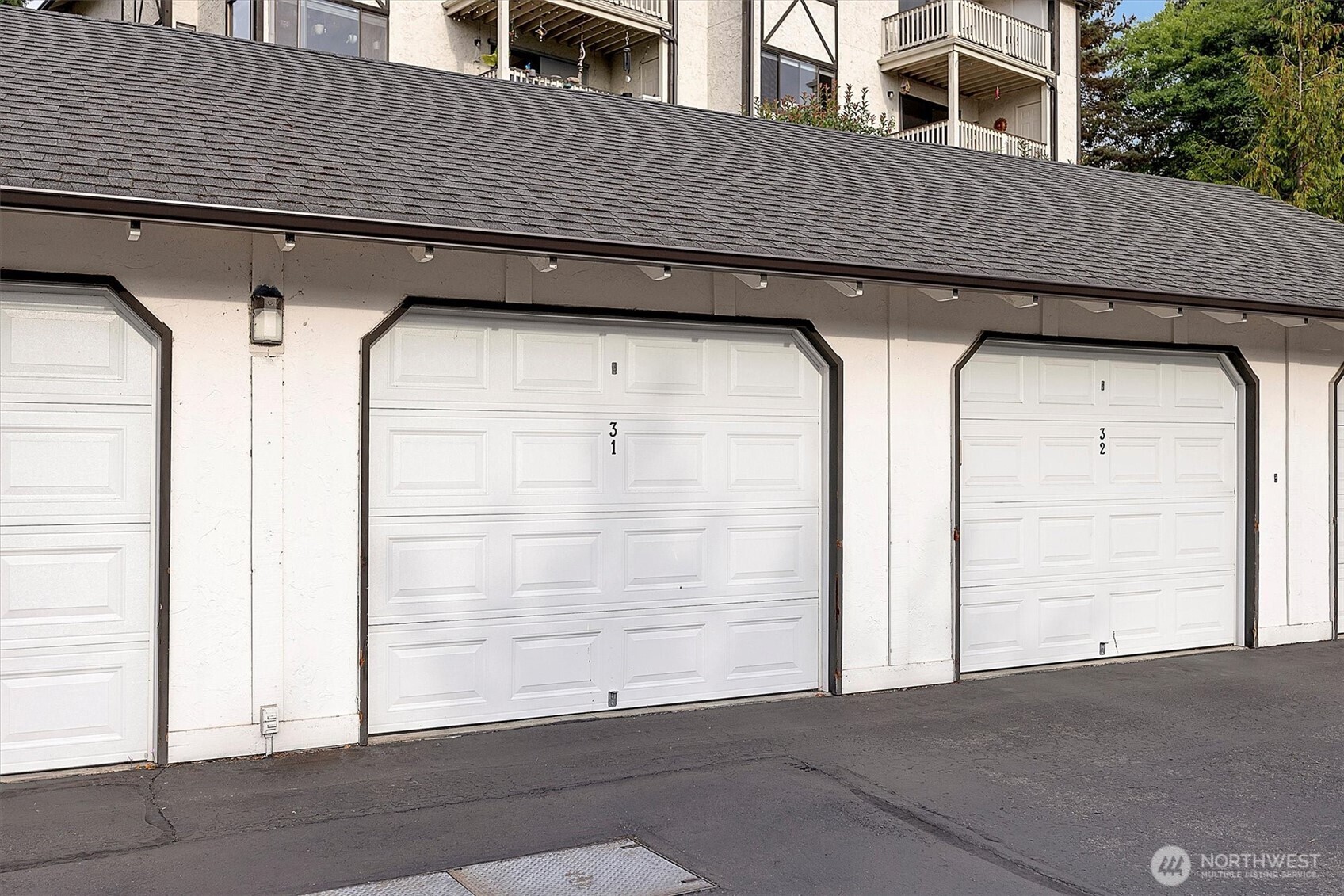 3410 161st Court Southeast, Unit 31 Bellevue, WA 98008 - Photo 24 of 25 a view of a house with a wooden bench