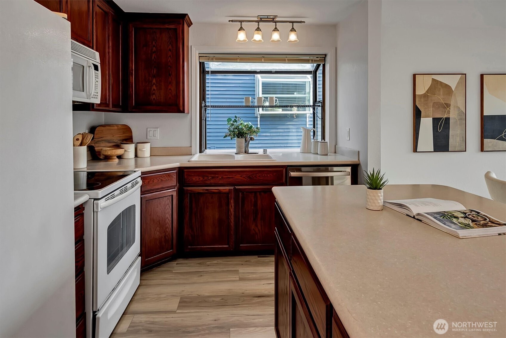3410 161st Court Southeast, Unit 31 Bellevue, WA 98008 - Photo 10 of 25 a kitchen with a sink stove and cabinets