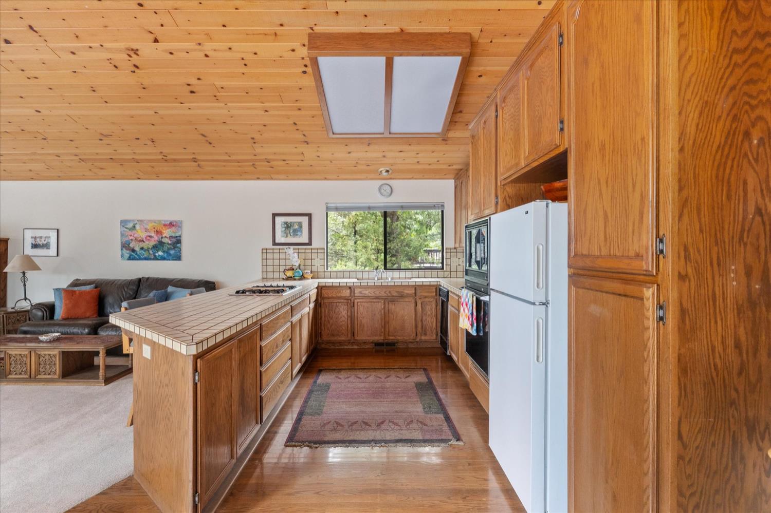 596 Sugarbush Lane Murphys, CA 95247 - Photo 11 of 48 a kitchen with a refrigerator and a stove