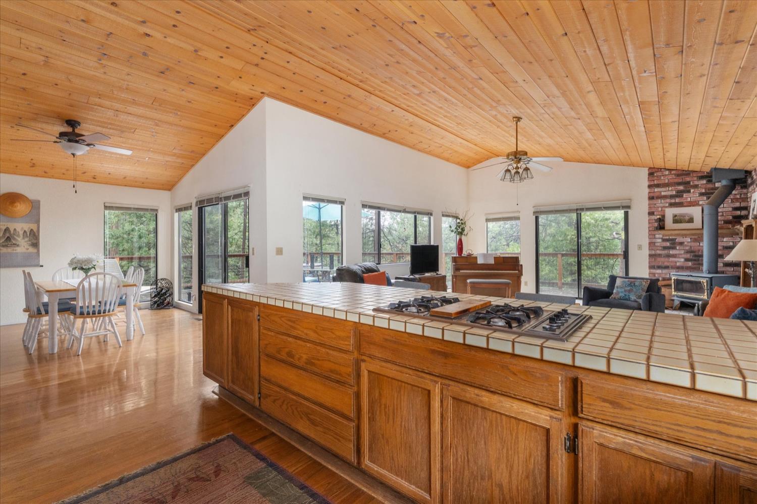 596 Sugarbush Lane Murphys, CA 95247 - Photo 15 of 48 a open kitchen with stainless steel appliances granite countertop a stove and cabinets with wooden floor