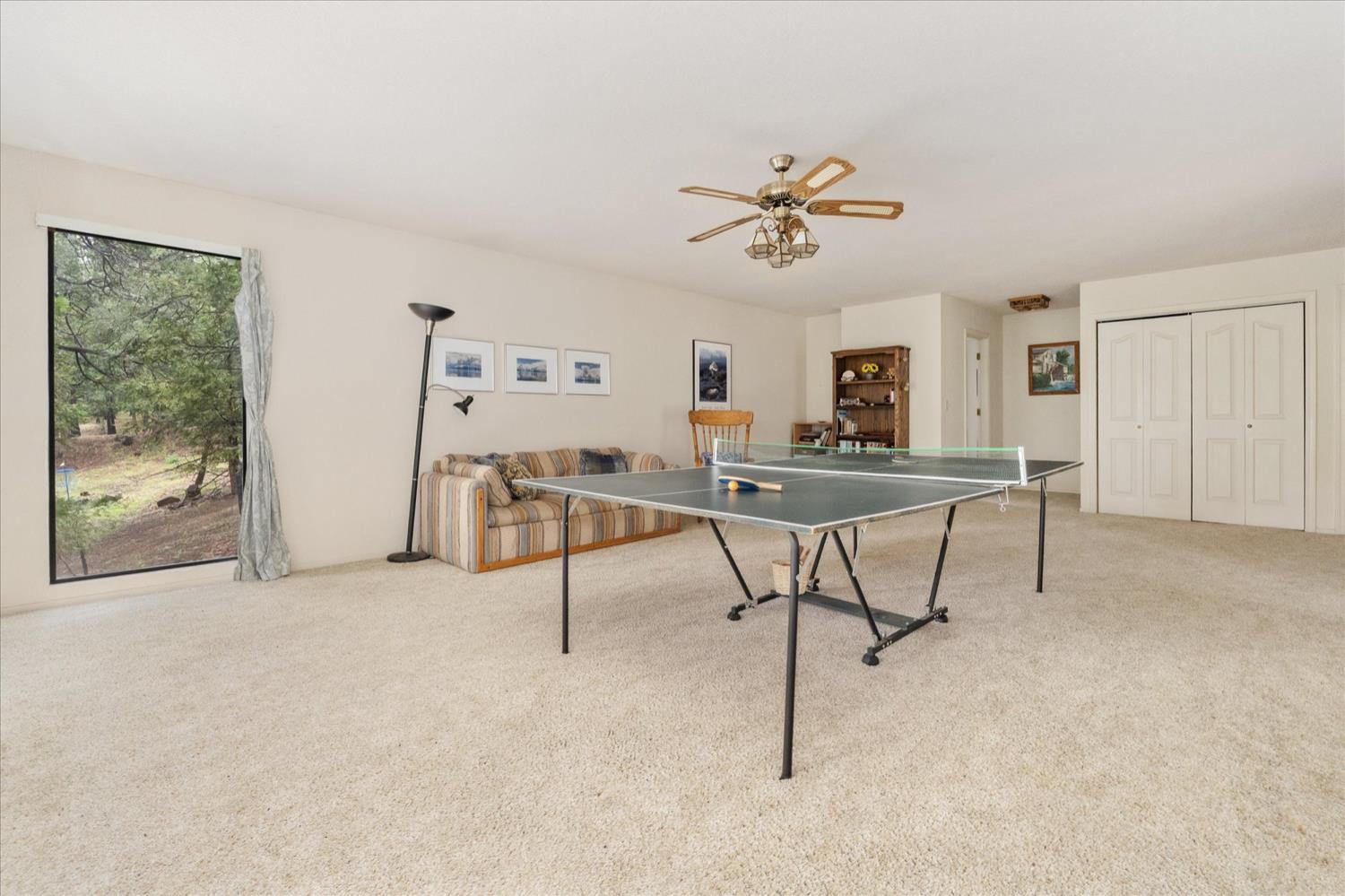 596 Sugarbush Lane Murphys, CA 95247 - Photo 38 of 48 a view of a livingroom with furniture and a ceiling fan