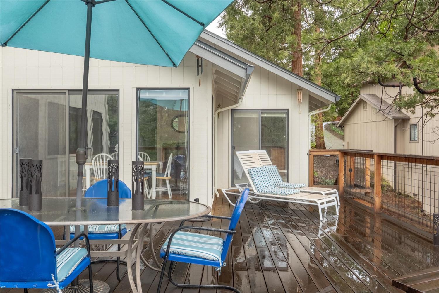 596 Sugarbush Lane Murphys, CA 95247 - Photo 46 of 48 a view of a patio with table and chairs under an umbrella