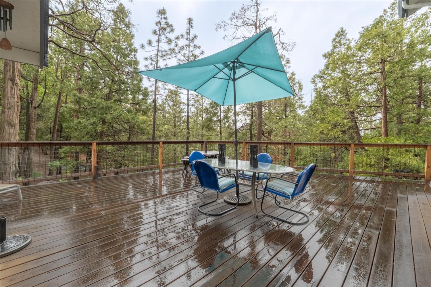 596 Sugarbush Lane Murphys, CA 95247 - Photo 9 of 48 a view of deck with chairs and wooden floor