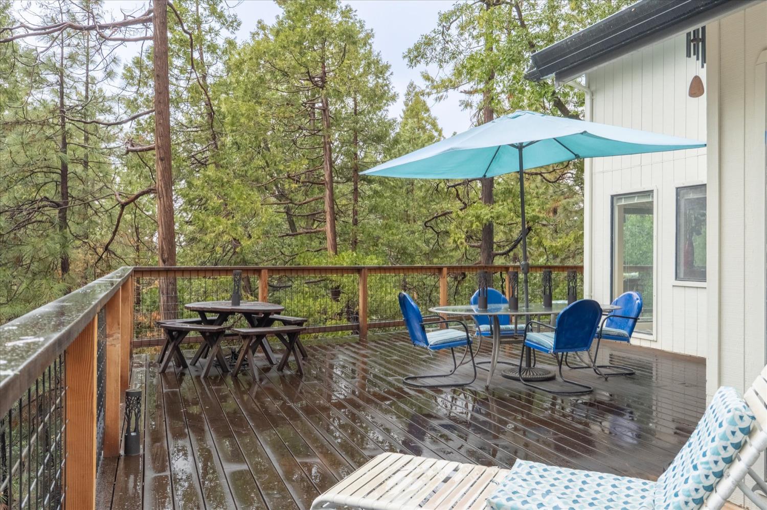 596 Sugarbush Lane Murphys, CA 95247 - Photo 10 of 48 a view of sitting area with furniture and umbrella