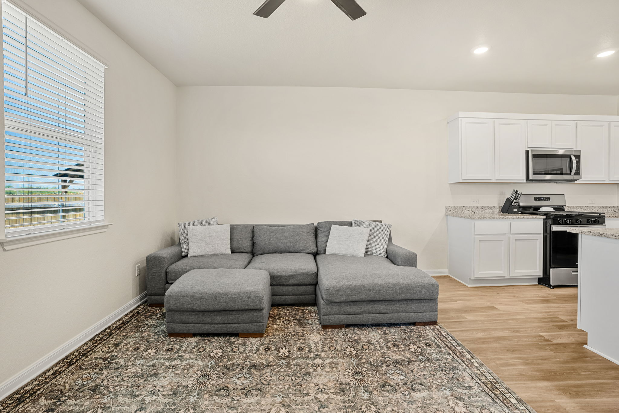 148 Hidalgo Lane Elgin, TX 78621 - Photo 15 of 38 An open concept living area seamlessly blends comfort with culinary convenience.