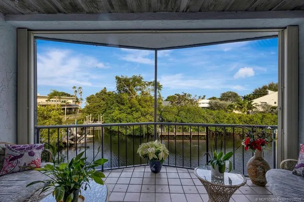 a view of a balcony with chairs