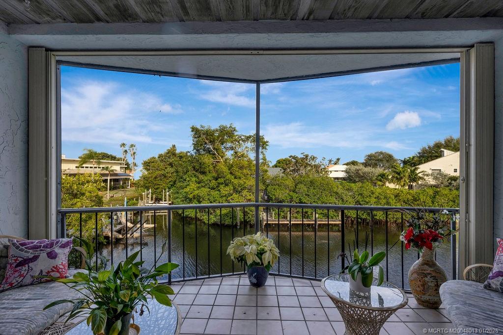 a view of a balcony with chairs