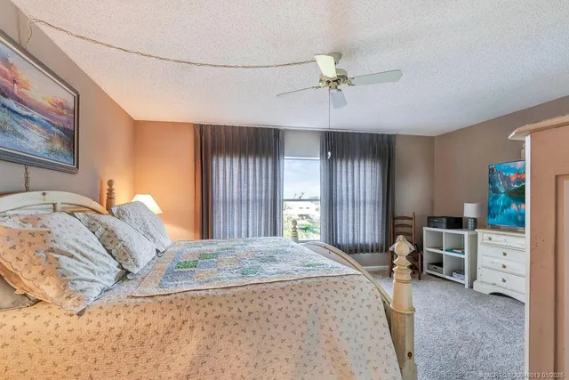 a bed room with a bed and a window