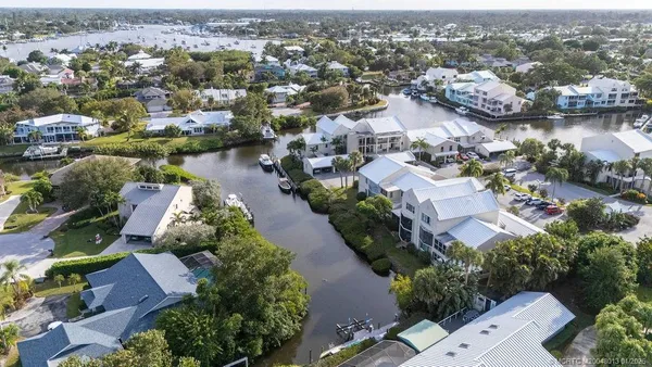 an aerial view of residential houses with outdoor space