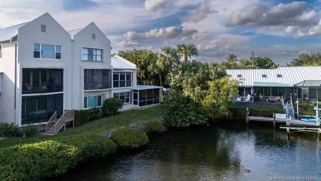 a aerial view of a house with a yard and a fountain