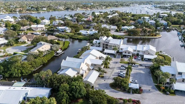 an aerial view of multiple houses with yard