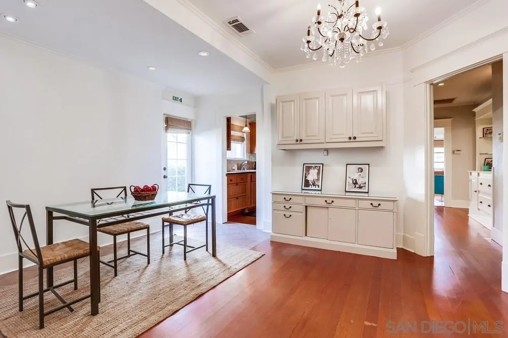 745 Main Street Ramona, CA 92065 - Photo 19 of 40 a kitchen with stainless steel appliances granite countertop a stove top oven a sink dishwasher and a dining table with wooden floor