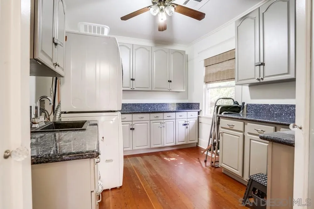 745 Main Street Ramona, CA 92065 - Photo 23 of 40 a kitchen with granite countertop cabinets stainless steel appliances and a counter space
