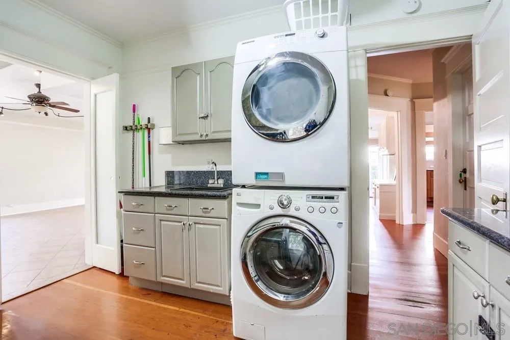 745 Main Street Ramona, CA 92065 - Photo 24 of 40 a view of a hallway with washer and dryer