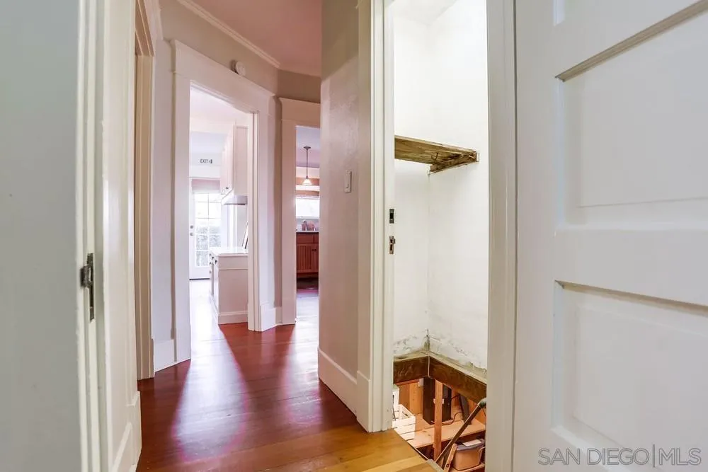 745 Main Street Ramona, CA 92065 - Photo 26 of 40 a view of a hallway with wooden floor and closet