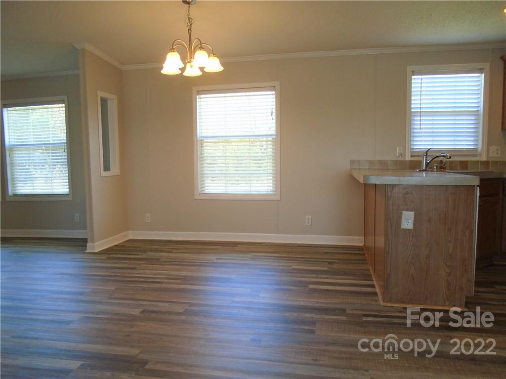 4730 Stagecoach Road Catawba, NC 28609 - Photo 14 of 37 an empty room with wooden floor and windows