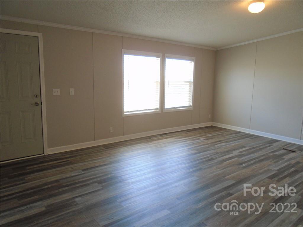 4730 Stagecoach Road Catawba, NC 28609 - Photo 17 of 37 an empty room with wooden floor and windows