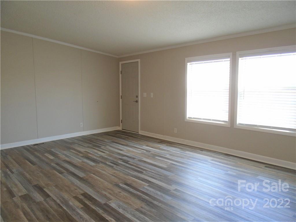 4730 Stagecoach Road Catawba, NC 28609 - Photo 18 of 37 a view of an empty room with wooden floor and a window
