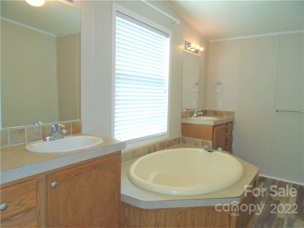 4730 Stagecoach Road Catawba, NC 28609 - Photo 24 of 37 a bathroom with a sink and a mirror