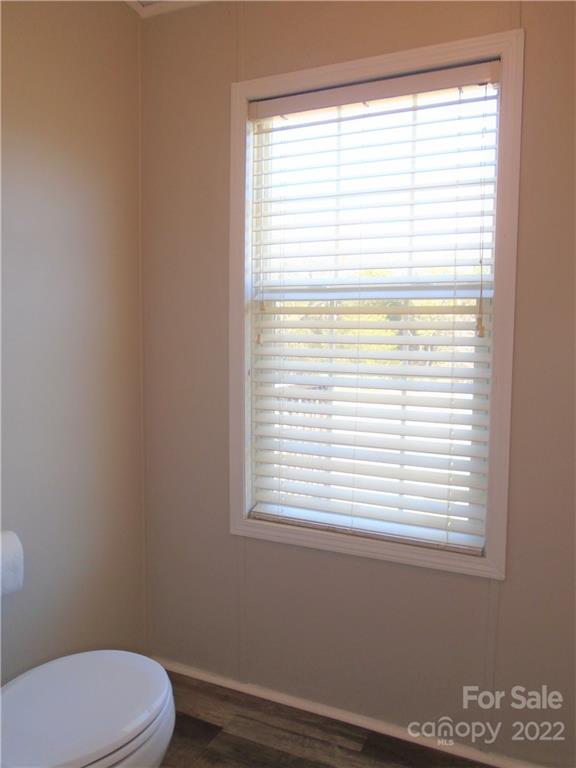 4730 Stagecoach Road Catawba, NC 28609 - Photo 33 of 37 a bathroom with a window a toilet and a window