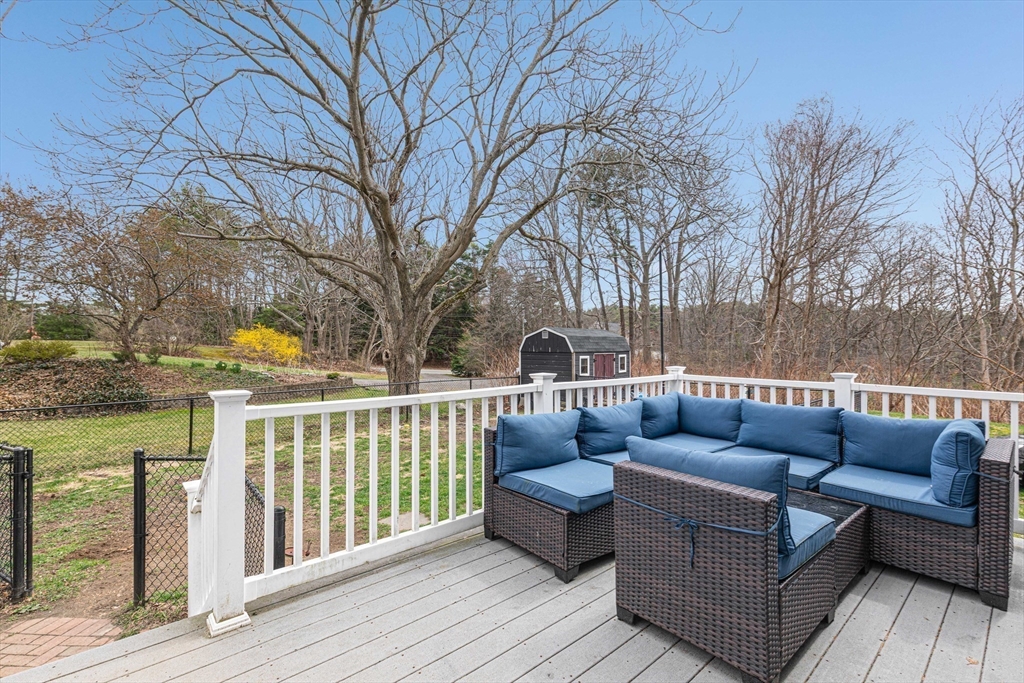 54 Old Merrill Street Amesbury, MA 01913 - Photo 31 of 34 a roof deck with couches and wooden floor