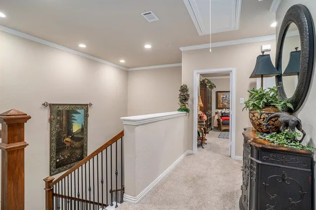a view of a dining room with furniture and a chandelier