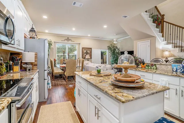 a kitchen with counter top space and cabinets