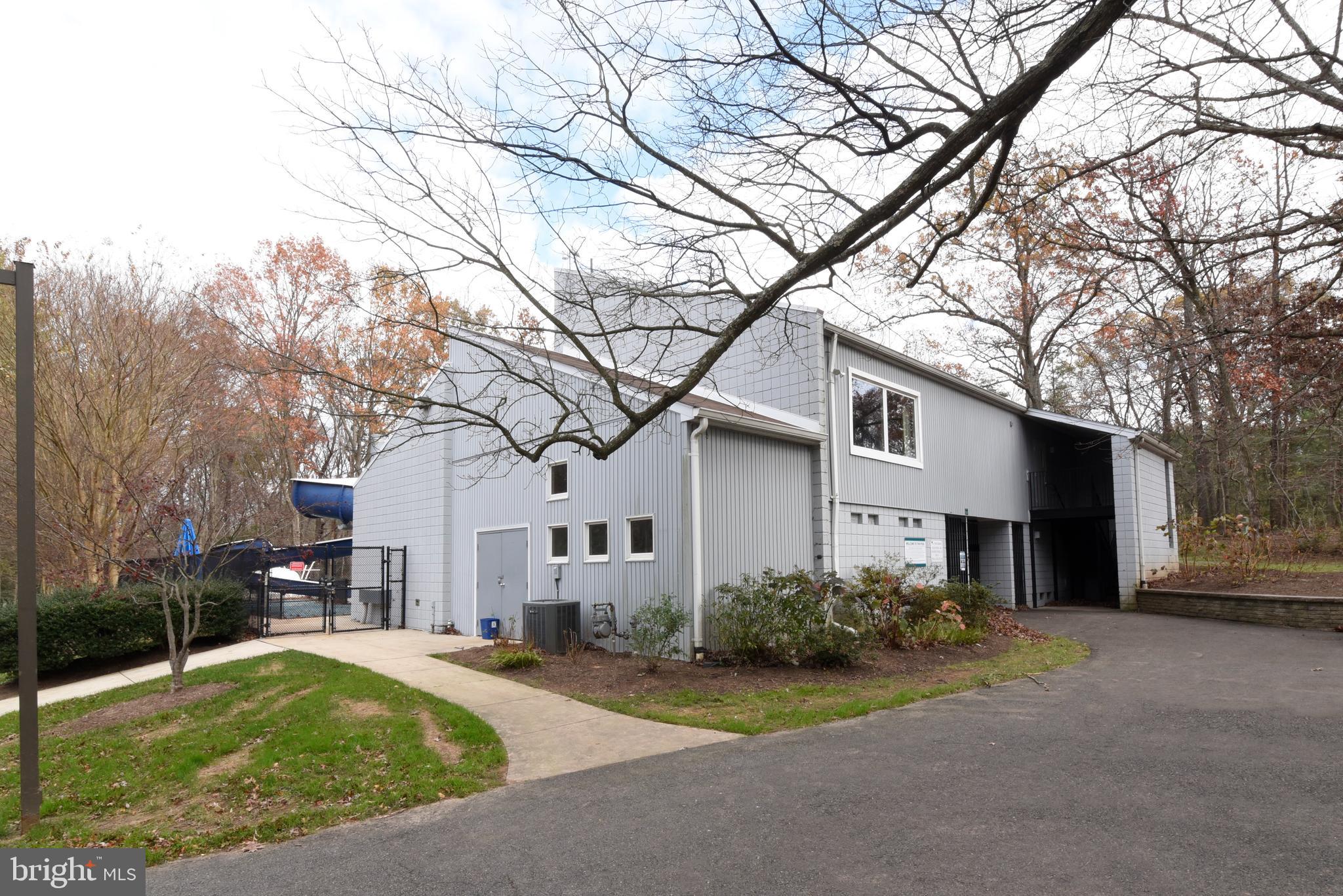 2334 Generation Drive Reston, VA 20191 - Photo 54 of 55 a front view of a house with a yard and garage