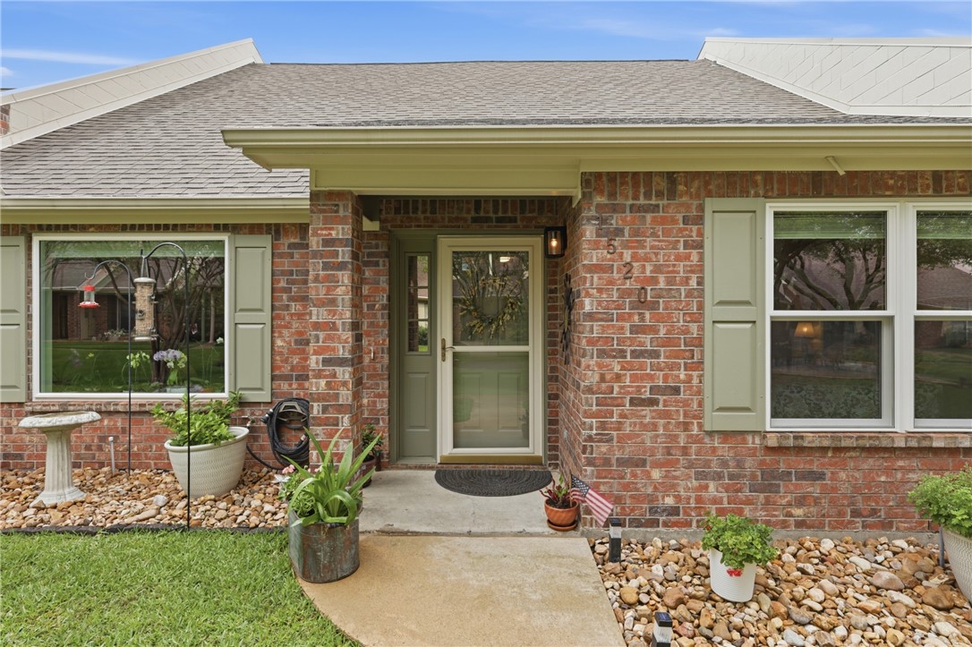 1520 Bennett Street Bryan, TX 77802 - Photo 3 of 24 a front view of a house with a garden