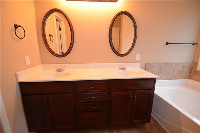 3749 Suiter Road Clarksville, TN 37040 - Photo 14 of 20 VERY SPACIOUS MASTER BATH SUITE WITH TWIN VANITY SINKS, LARGE GARDEN TUB AND SEPARATE SHOWER. PRIVACY ALCOVE FOR TOILET. LARGE WALK IN CLOSET
