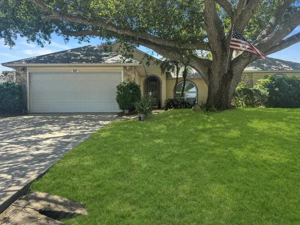 front view of a house with a yard