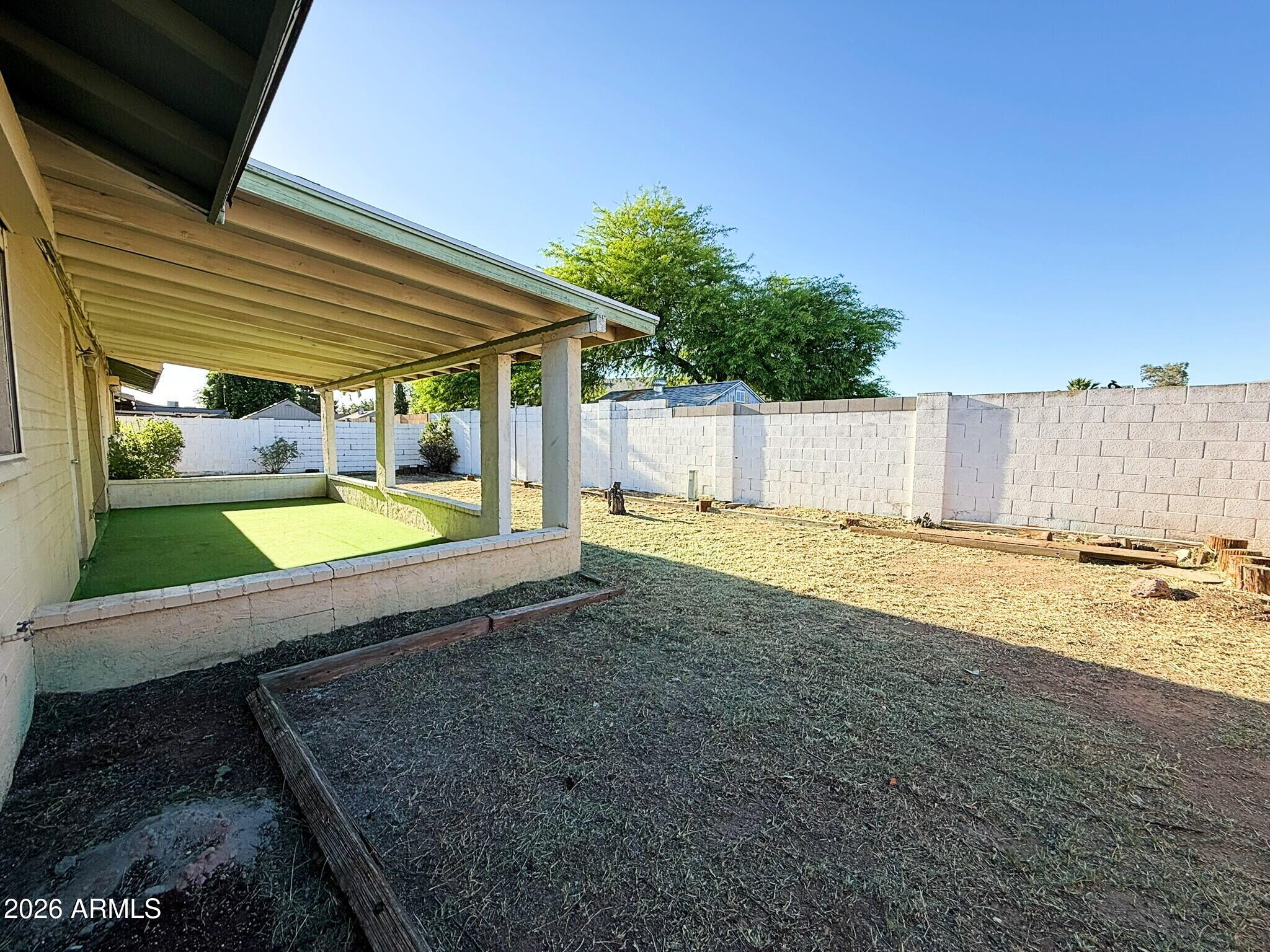 5208 West Calavar Road Glendale, AZ 85306 - Photo 23 of 39 a view of a backyard with a small cabin