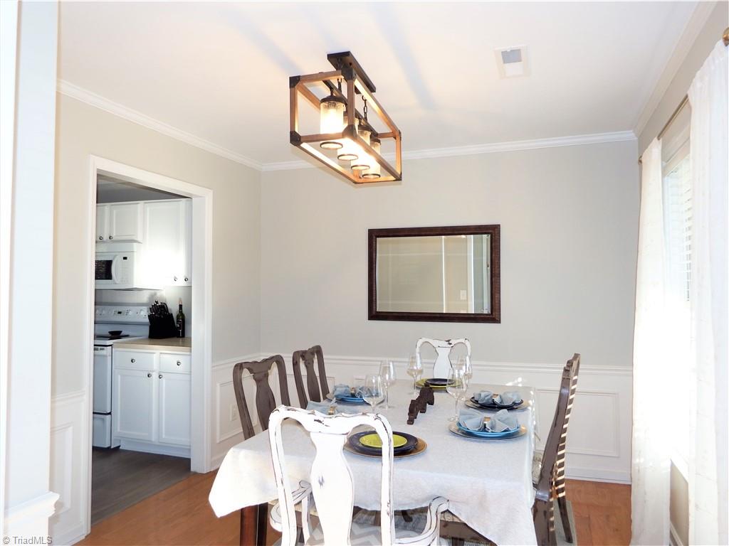 1730 Spring Path Trail Clemmons, NC 27012 - Photo 5 of 21 Bright Formal Dining Room with Chair Rail and Wainscoting