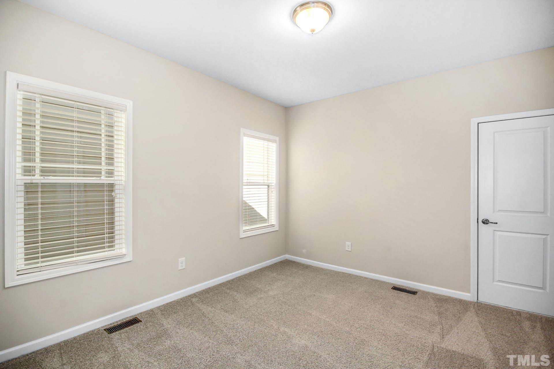 1524 Rodessa Run Raleigh, NC 27607 - Photo 17 of 25 an empty room with windows