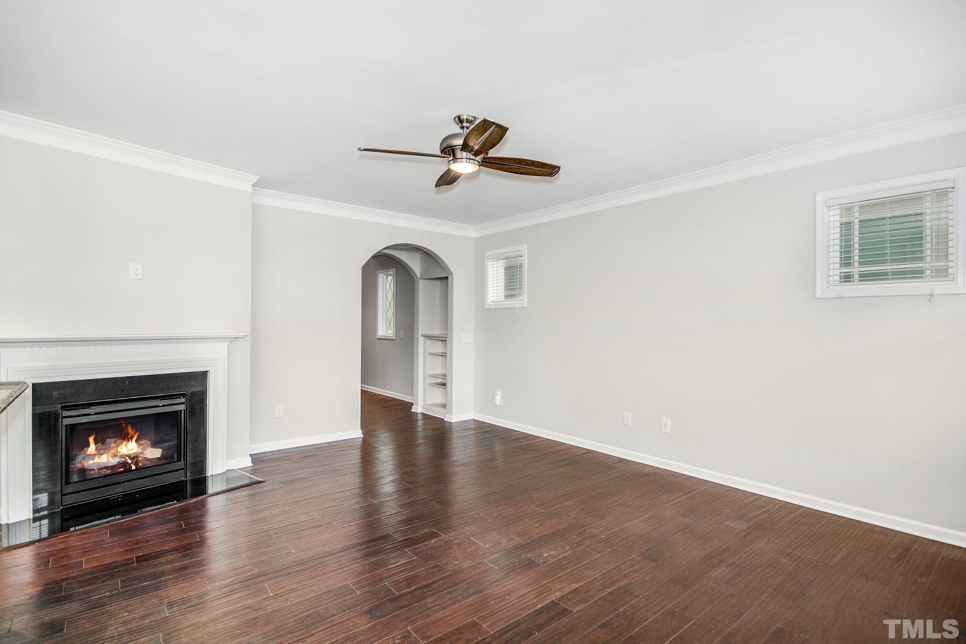 1524 Rodessa Run Raleigh, NC 27607 - Photo 6 of 25 an empty room with fireplace and a fireplace