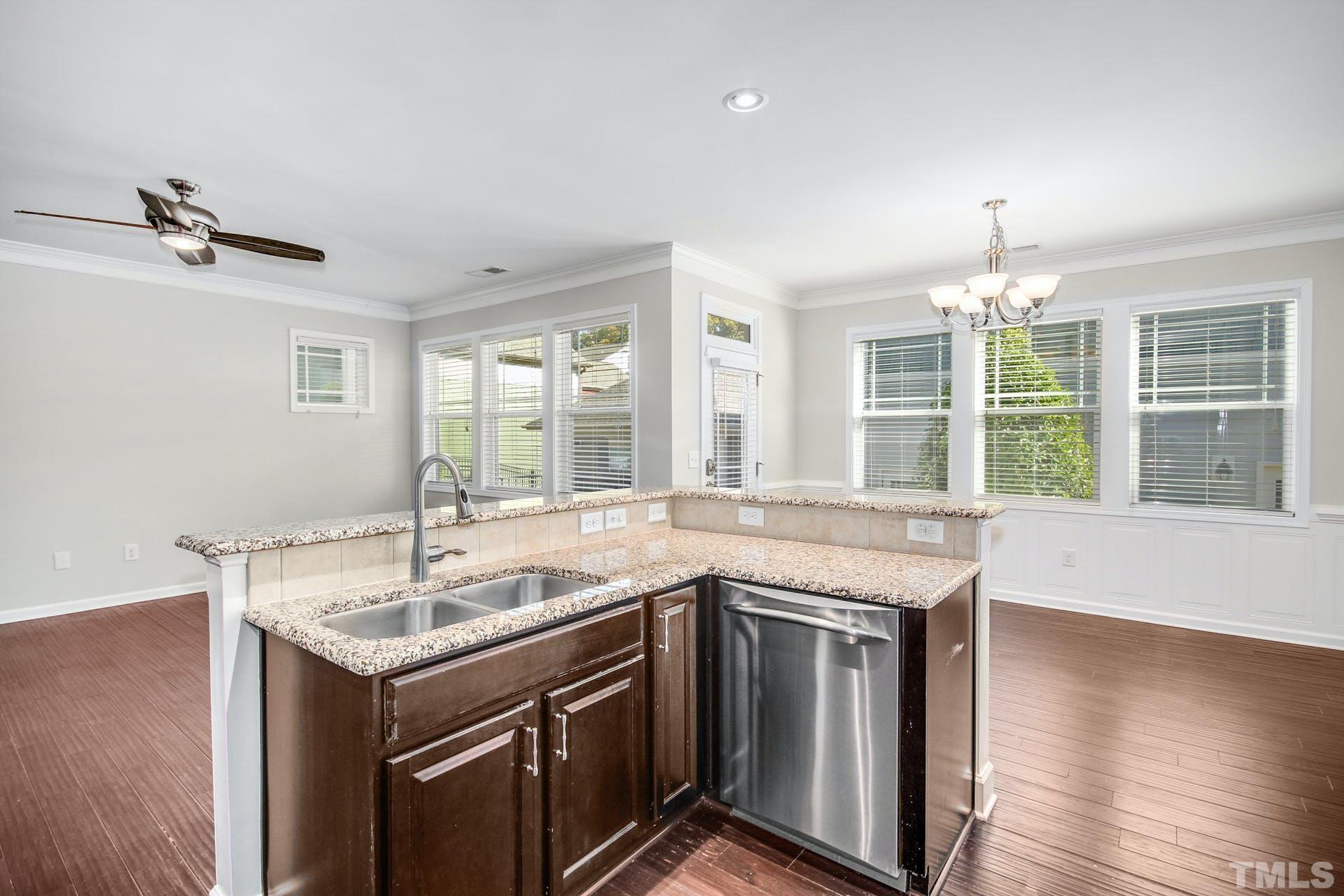 1524 Rodessa Run Raleigh, NC 27607 - Photo 9 of 25 a kitchen that has a sink and a stove