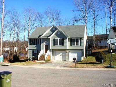 7919 Featherchase Place Chesterfield, VA 23832 - Photo 1 of 1 a front view of a house with a yard