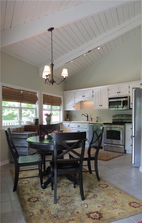 51 Harbor Road Naples, ME 04055 - Photo 7 of 35 View of the dining area and kitchen...