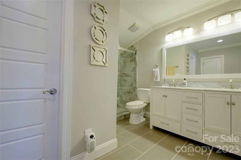 83 Ridgeport Road Lake Wylie, SC 29710 - Photo 25 of 48 a bathroom with a granite countertop sink toilet and a mirror