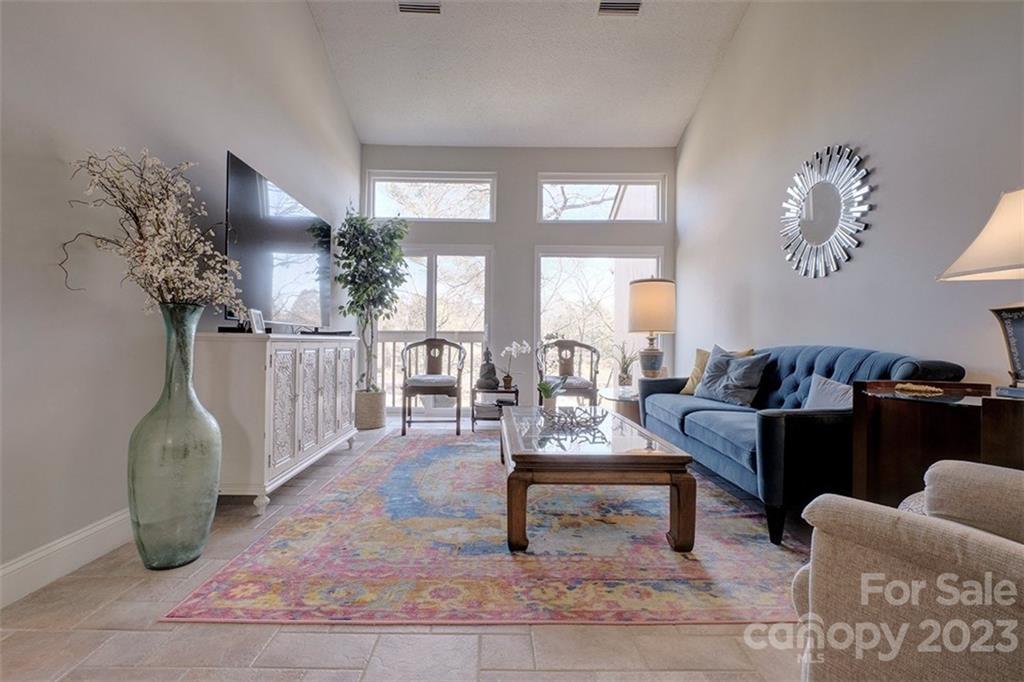 83 Ridgeport Road Lake Wylie, SC 29710 - Photo 10 of 48 a living room with furniture and a potted plant