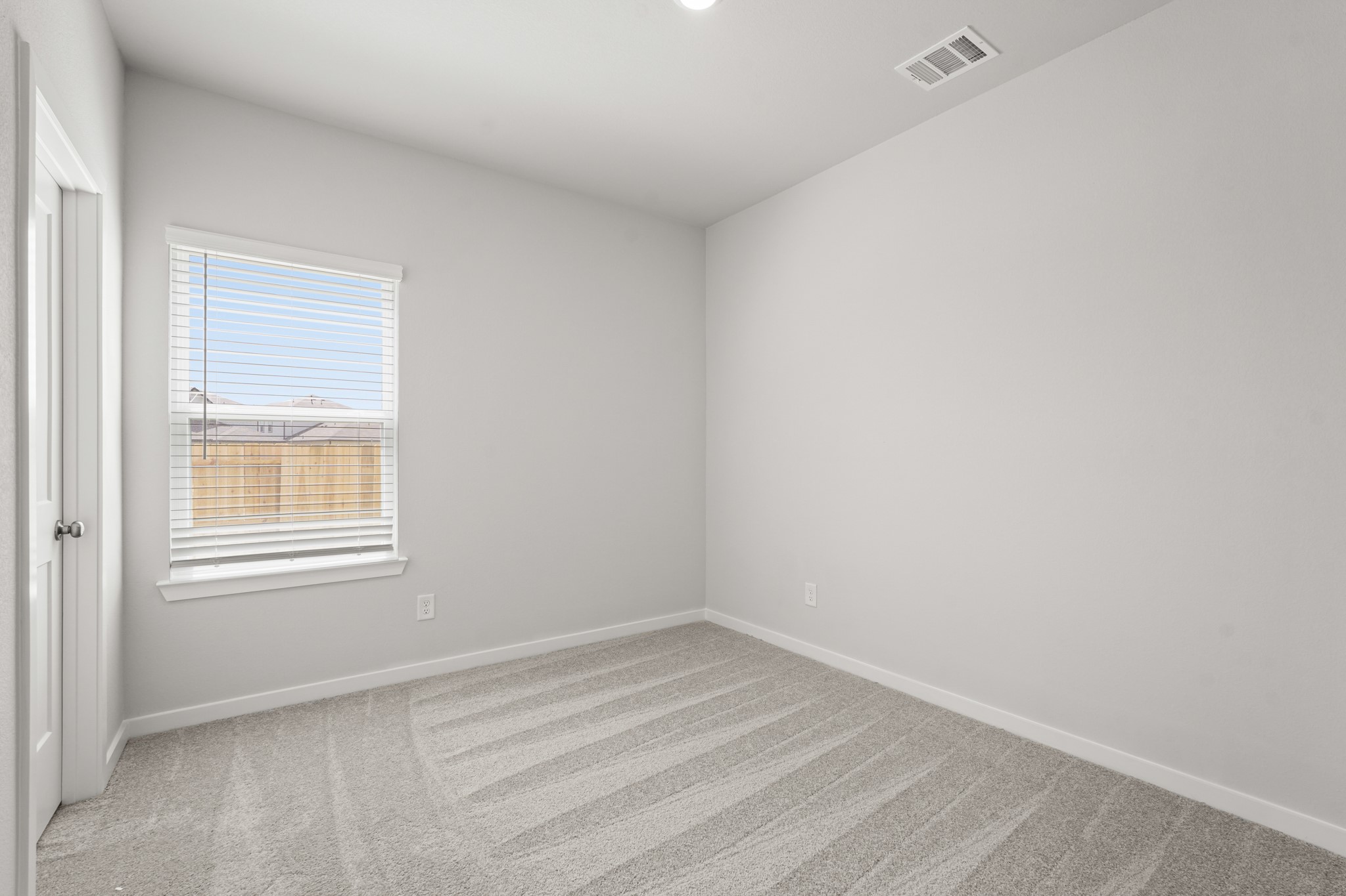 213 Spring Drive Hockley, TX 77447 - Photo 10 of 26 an empty room with a window