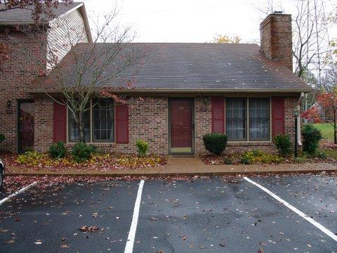 705 Kent Road, Unit 705 Nashville, TN 37214 - Photo 2 of 6 a front view of a house with garden and plants