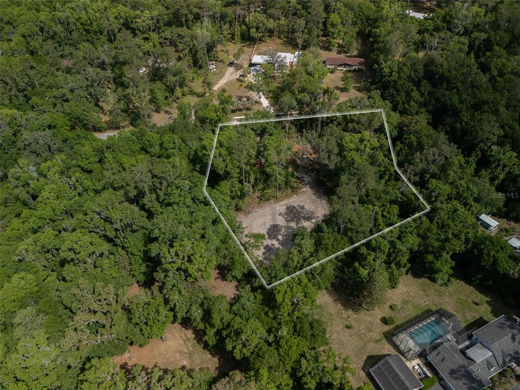 983 Southwest 25th Place Gainesville, FL 32608 - Photo 1 of 13 an aerial view of a house