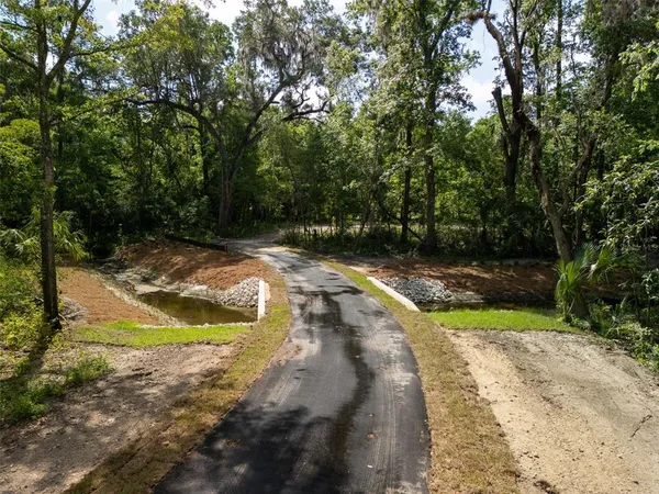 a view of swimming pool with a yard