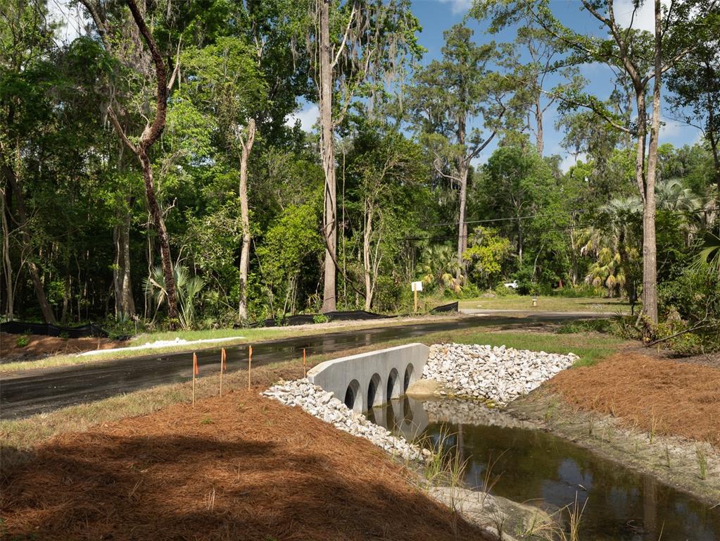 983 Southwest 25th Place Gainesville, FL 32608 - Photo 5 of 13 a view of a swimming pool with a patio and a yard
