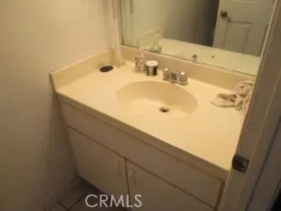 a bathroom with a sink and a mirror