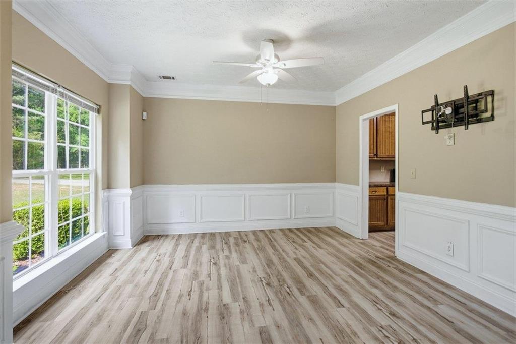 1231 Hillview Road Hampton, GA 30228 - Photo 14 of 49 wooden floor in an empty room with a window