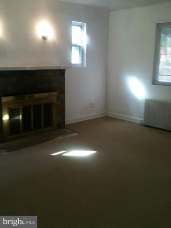 a view of a livingroom with a fireplace